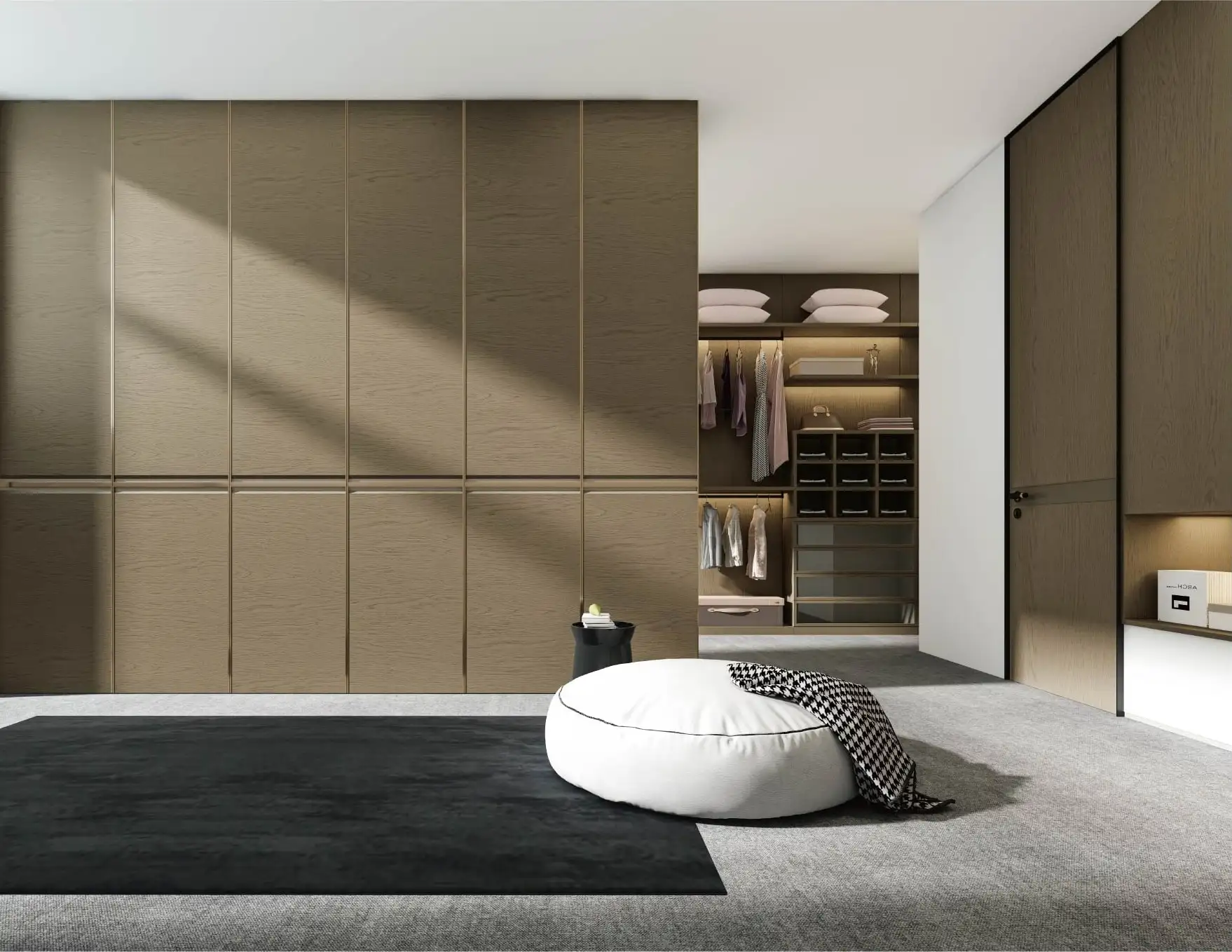 Bronze wardrobe wall with a concealed door opening to a lit walk-in closet