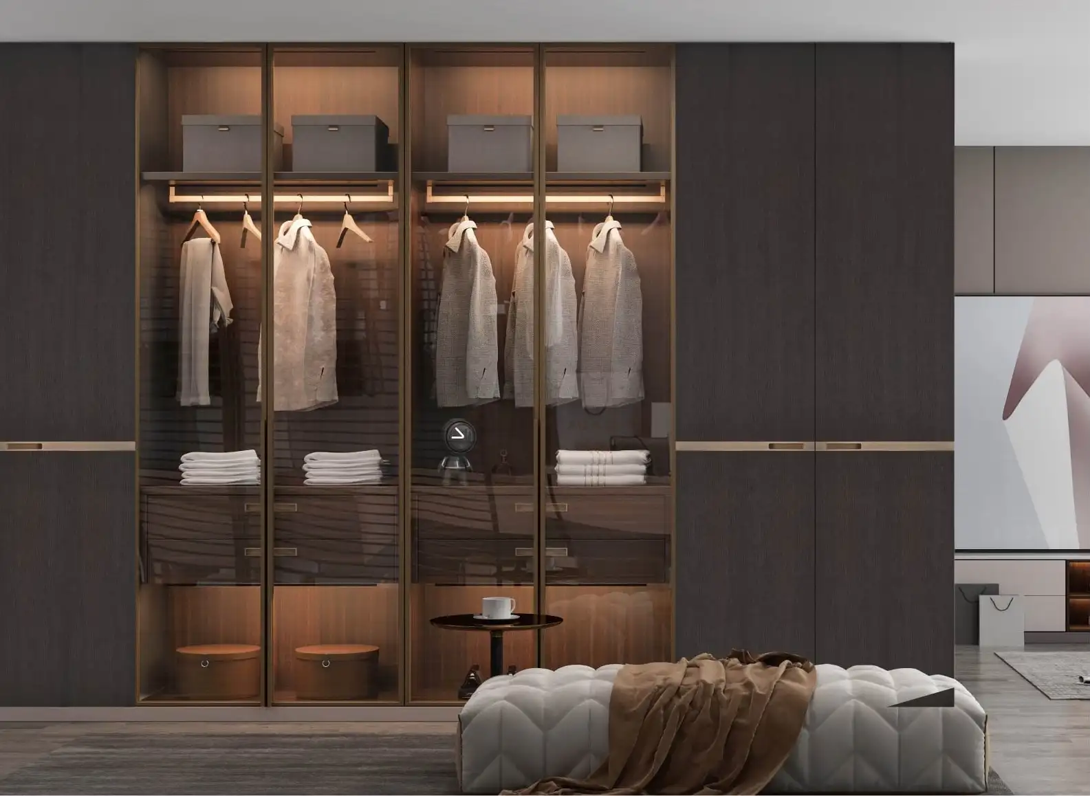Walnut wardrobe run with bronze-framed glass doors, lit rails and folded storage