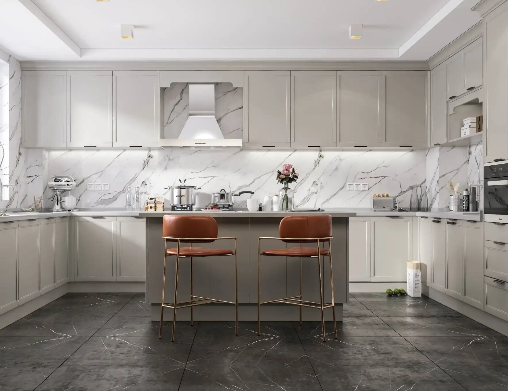 White kitchen with a mantel hood, marble backsplash and an island with leather stools