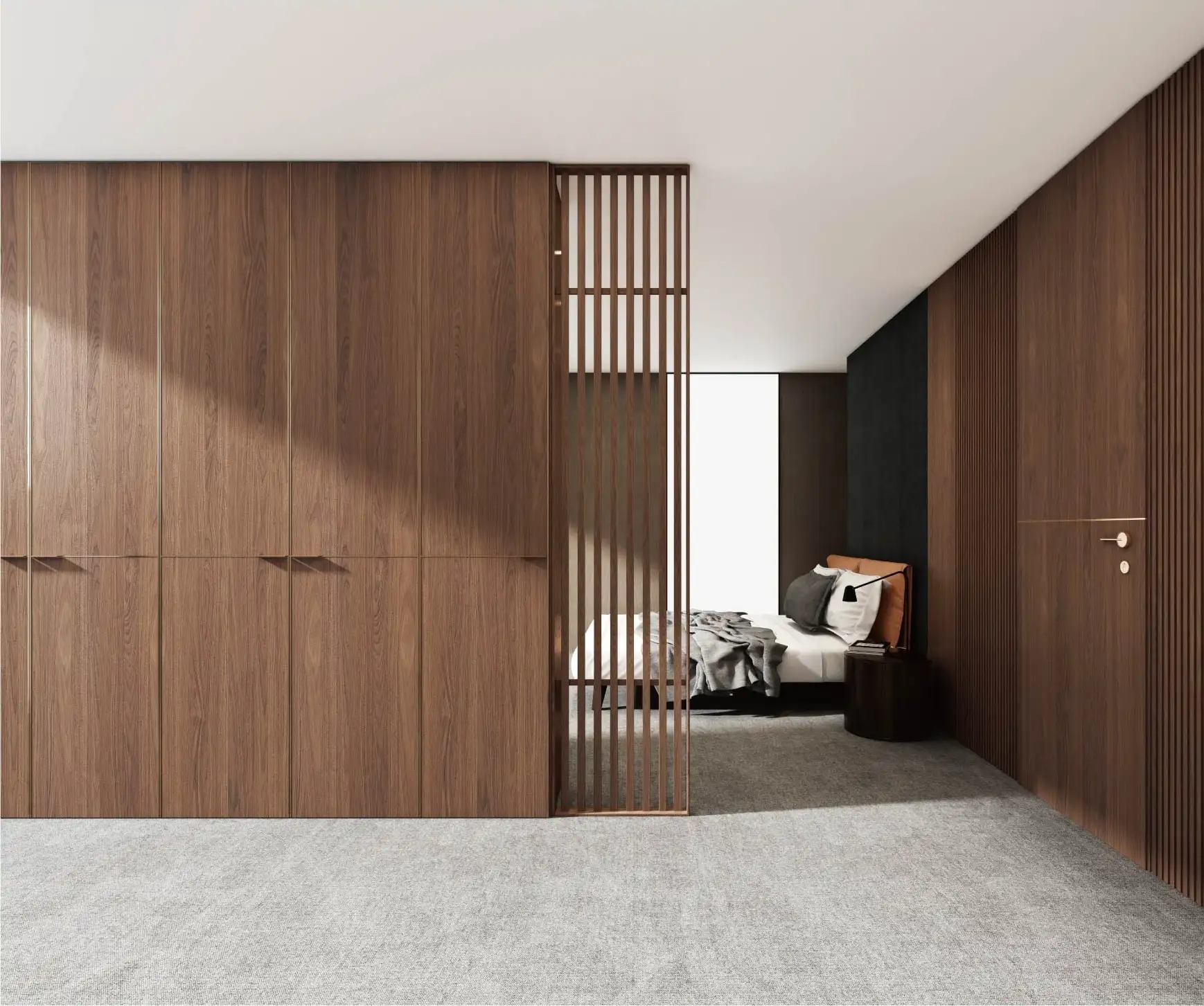 Walnut wardrobe wall with a slatted screen dividing the bedroom beyond